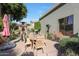 Outdoor patio with seating area, heater, and umbrella at 4808 N Litchfield E Knl, Litchfield Park, AZ 85340
