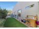 Artificial turf side yard with potting bench and storage at 4808 N Litchfield E Knl, Litchfield Park, AZ 85340