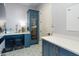 Laundry/wine room with blue cabinetry, quartz countertops and a wine refrigerator at 5019 E Lucia Dr, Cave Creek, AZ 85331