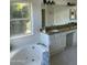 Bathroom with soaking tub and double sinks at 5286 W Lone Cactus Dr, Glendale, AZ 85308