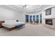 Spacious primary bedroom with fireplace and stunning city views at 5316 E Valle Vista Rd, Phoenix, AZ 85018