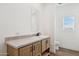 Bathroom with a vanity, toilet, and a window with blinds at 53929 W Bowlin Rd, Maricopa, AZ 85139