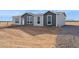 Manufactured home with gravel landscaping at 53929 W Bowlin Rd, Maricopa, AZ 85139