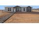 Gray and white manufactured home with walkway at 53929 W Bowlin Rd, Maricopa, AZ 85139