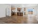 Open concept kitchen with island and wood flooring at 53929 W Bowlin Rd, Maricopa, AZ 85139