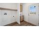 Laundry room with built-in cabinets and exterior access at 53929 W Bowlin Rd, Maricopa, AZ 85139