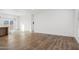 Bright living room features wood-look floors and large window at 53929 W Bowlin Rd, Maricopa, AZ 85139