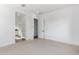 Clean bedroom featuring white walls, neutral carpet and an ensuite bathroom at 5471 S Red Rock St, Gilbert, AZ 85298