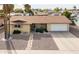 Single story home with driveway and stone pathway at 6109 E Boise St, Mesa, AZ 85205