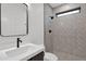 Bathroom with patterned tile shower and vanity at 6216 W Molly Dr, Phoenix, AZ 85083