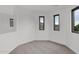 Bright bedroom with grey carpet and multiple windows at 6216 W Molly Dr, Phoenix, AZ 85083