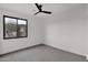 Spacious bedroom with ceiling fan and window views at 6216 W Molly Dr, Phoenix, AZ 85083