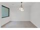Simple dining room with modern light fixture at 6216 W Molly Dr, Phoenix, AZ 85083