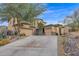 Two-story house with three-car garage and desert landscaping at 6216 W Molly Dr, Phoenix, AZ 85083