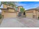 Two-story house with three-car garage and desert landscaping at 6216 W Molly Dr, Phoenix, AZ 85083