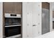 Modern kitchen with built-in oven and stainless steel appliances at 6216 W Molly Dr, Phoenix, AZ 85083