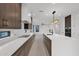 Modern kitchen with island, stainless steel appliances, and dark wood cabinets at 6216 W Molly Dr, Phoenix, AZ 85083