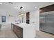Modern kitchen with island, stainless steel appliances, and dark wood cabinets at 6216 W Molly Dr, Phoenix, AZ 85083