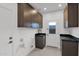 Convenient laundry room with ample storage and countertop space at 6216 W Molly Dr, Phoenix, AZ 85083