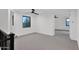 Open loft bedroom with large windows and a ceiling fan at 6216 W Molly Dr, Phoenix, AZ 85083