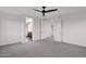 Main bedroom with carpet, ceiling fan and ensuite bathroom access at 6216 W Molly Dr, Phoenix, AZ 85083