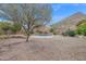 Relaxing kidney-shaped pool in backyard at 6216 W Molly Dr, Phoenix, AZ 85083