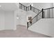 Elegant modern staircase with black metal railing at 6216 W Molly Dr, Phoenix, AZ 85083