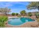 Inviting kidney-shaped pool with surrounding landscaping at 6216 W Molly Dr, Phoenix, AZ 85083