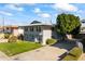 Two-story building with a large tree and parking lot at 6547 N 3Rd Ave, Phoenix, AZ 85013