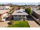 Two-story building with ample parking and a grassy yard at 6547 N 3Rd Ave, Phoenix, AZ 85013