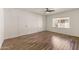 Well-lit bedroom with wood-look floors and double closets at 6547 N 3Rd Ave, Phoenix, AZ 85013