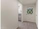 Bright entryway with tile flooring, leading to kitchen and exterior door at 6547 N 3Rd Ave, Phoenix, AZ 85013