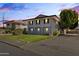 Two-story house with gray exterior, landscaping, and driveway at 6547 N 3Rd Ave, Phoenix, AZ 85013