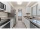 Kitchen boasts granite countertops and stainless steel appliances at 6547 N 3Rd Ave, Phoenix, AZ 85013