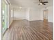 Spacious living area with wood-look floors and patio access at 6547 N 3Rd Ave, Phoenix, AZ 85013