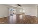 Living room with wood-look floors and sliding door to patio at 6547 N 3Rd Ave, Phoenix, AZ 85013
