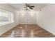 Spacious living room featuring wood-look flooring and ceiling fan at 6547 N 3Rd Ave, Phoenix, AZ 85013