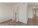 Living room with wood-look floors and access to kitchen at 6547 N 3Rd Ave, Phoenix, AZ 85013