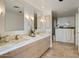 Elegant bathroom with dual vanity and walk-in shower at 7181 E Camelback Rd # 904, Scottsdale, AZ 85251