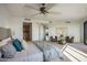 Bright bedroom with plush bedding and sitting area at 7181 E Camelback Rd # 904, Scottsdale, AZ 85251