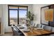 Modern dining room with wood table and city views at 7181 E Camelback Rd # 904, Scottsdale, AZ 85251