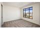 Bright, empty room with large windows offering views of the surrounding cityscape at 7181 E Camelback Rd # 904, Scottsdale, AZ 85251