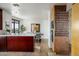 Modern kitchen with dark wood cabinets and island at 7181 E Camelback Rd # 904, Scottsdale, AZ 85251