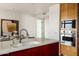 Modern kitchen with stainless steel appliances and island at 7181 E Camelback Rd # 904, Scottsdale, AZ 85251