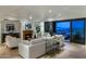 Bright living room with a fireplace and access to a balcony with city views at 7181 E Camelback Rd # 904, Scottsdale, AZ 85251