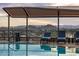 Rooftop pool with lounge chairs and covered seating at 7181 E Camelback Rd # 904, Scottsdale, AZ 85251