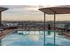 Rooftop pool with lounge chairs and covered seating areas at 7181 E Camelback Rd # 904, Scottsdale, AZ 85251