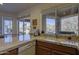 Kitchen with granite countertops, sink, and views of desert landscape at 7500 E Boulders Pkwy # 23, Scottsdale, AZ 85266