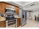 View of kitchen with stainless steel appliances and granite counters at 7858 E Glenrosa Ave, Scottsdale, AZ 85251