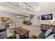 Two-story living room with a spiral staircase, showcasing the open floor plan at 7858 E Glenrosa Ave, Scottsdale, AZ 85251